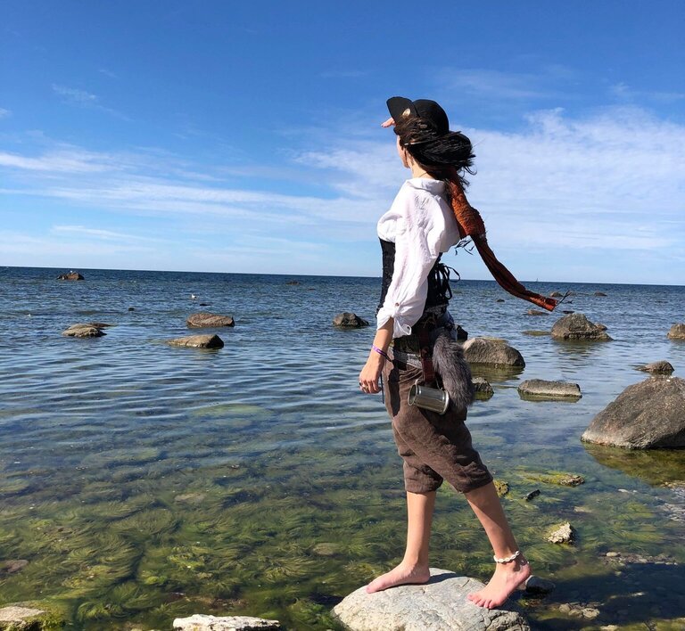 me in pirate outfit looking out to sea